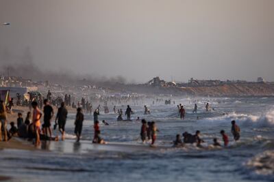 Palestinian families on the beach of Gaza city, where they have been told they can no longer go. EPA