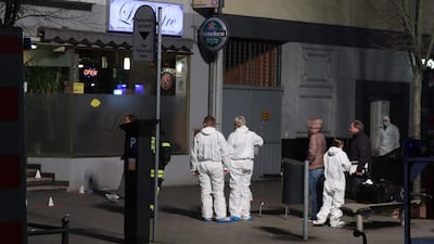 Police and Forensic police investigate the scene of a shooting in Hanau, western Germany. AFP