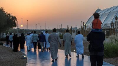 Worshippers celebrate Eid Al Fitr outside Sheikh Zayed Mosque early on Tuesday morning.