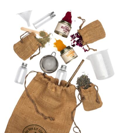 The kit comes with natural herbs and coloured powders, along with sieves, bottles and funnels. Photo: The Den Kit Co.