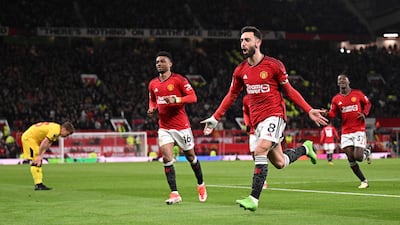 Manchester United's Portuguese midfielder #08 Bruno Fernandes celebrates scoring the team's third goal during the English Premier League football match between Manchester United and Sheffield United at Old Trafford in Manchester, north west England, on April 24, 2024. (Photo by Oli SCARFF / AFP) / RESTRICTED TO EDITORIAL USE. No use with unauthorized audio, video, data, fixture lists, club/league logos or 'live' services. Online in-match use limited to 120 images. An additional 40 images may be used in extra time. No video emulation. Social media in-match use limited to 120 images. An additional 40 images may be used in extra time. No use in betting publications, games or single club/league/player publications. /