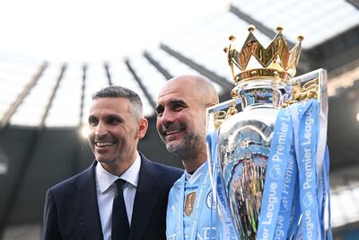 Khaldoon Al Mubarak, Chairman of Manchester City, and Pep Guardiola, manager of Manchester City, with the Premier League trophy. Getty Images