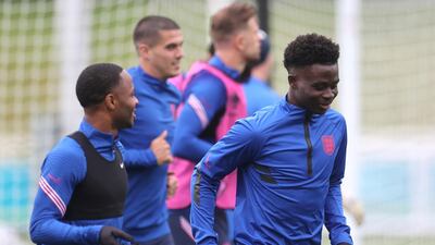 England's Raheem Sterling and Bukayo Saka during England's training camp at St George's Park, Burton Upon Trent, ahead of their Euro 2020 game with Germany on Tuesday. Reuters