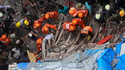 According to reports, two people died, seven injured and several others feared trapped when a four-story residential building collapsed. EPA