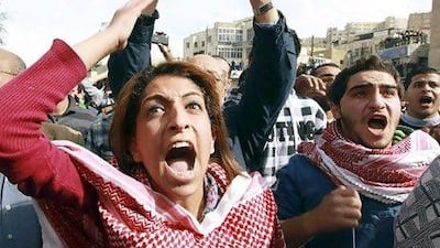 Protesters shout slogans in Amman after the Jordanian government announced the removal of fuel subsidies. Muhammad Hamed / Reuters