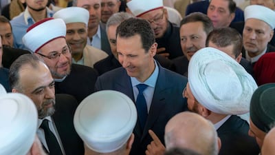 The US State Department has denied reports of a visit by US officials to Damascus to meet Ali Mamlouk, the security chief for Syrian President Bashar Al Assad, centre. Sana / Reuters