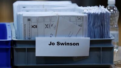 Ballots in a tray labelled Jo Swinson, Liberal Democrats candidate for East Dunbartonshire, are seen at a counting centre for Britain's general election in Bishopbriggs, Britain. Reuters