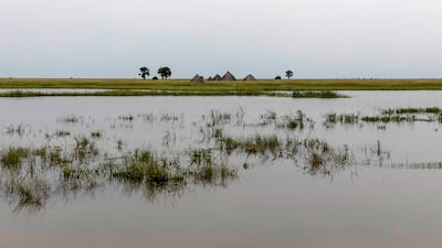 Tukuls – local huts made of mud and grass – surrounded by water near Malualkon. The UN says flooding has affected almost a half-million people across South Sudan since May.