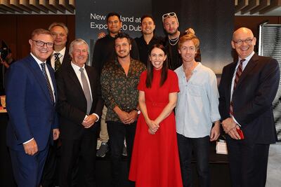 New Zealand Prime Minister Jacinda Ardern pictured with the band Six60, Clayton Kimpton, Commissioner General for New Zealand Expo and government officials during the New Zealand at Expo 2020 event in Auckland. Getty Images.