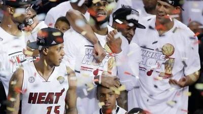 Miami Heat players celebrate after winning Game 7 of the NBA Finals 95-88 against the San Antonio Spurs. Wilfredo Lee / AP Photo