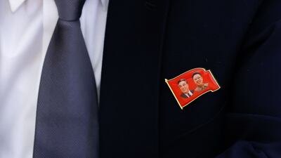A delegate wears a pin badge to mark the occasion as Russian Foreign Minister Sergey Lavrov meets his North Korean counterpart Choe Son-hui in Moscow. AFP