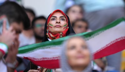 Iran fans show their support during the FIFA World Cup Group B match in 2022. Martin Rickett/PA Wire.