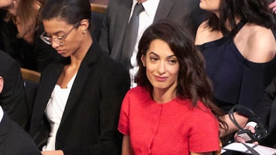 Amal Clooney, in a belted red midi, attends the Nobel Peace Prize ceremony on December 10, 2018 in Oslo, Norway. Getty Images