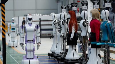 An 'ADA GH5' humanoid hybrid robot and other humanoid robots at Akinrobotics. Murad Sezer/Reuters
