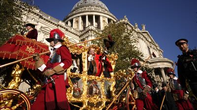The State Coach passing St Paul's Cathedral. PA