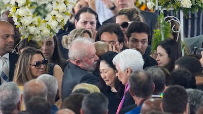 Brazil President Luiz Inacio Lula da Silva gives his condolences to the family of Pele. AP