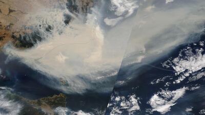 A satellite image made available by NASA shows thick smoke moving into the Tasman Sea from the states of New South Wales and Victoria on January 3, 2020 (issued 14 January 2020). EPA/NASA HO