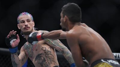 Sean O'Malley defends against Raulian Paiva at T-Mobile Arena. Reuters