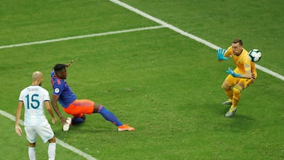 Colombia substitute Duvan Zapata, second left, scores against Argentina goalkeeper Franco Armani. EPA