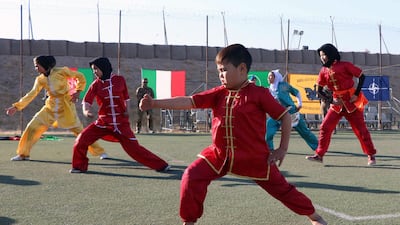 Afghan girls show their skills during an event organised by Nato as part of its mission to distribute aid to Ansar Orphanage and Afghan Women Sports Association, in Herat, Afghanistan. EPA