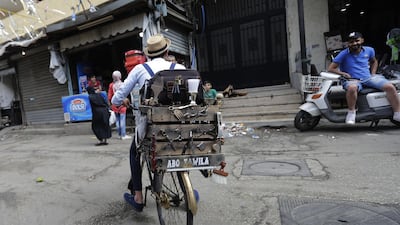 Just 18, Mohammed buzzes through district of Burj Al Barajneh looking for clients.