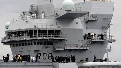 The 65,000-tonne HMS Queen Elizabeth is one of two carriers being built at a combined cost of £6.2 billion (Dh31 billion) overhaul Britain's naval capabilities. Andy Buchanan / AFP