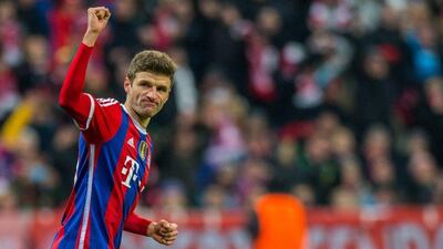 Bayern Munich's Thomas Muller celebrates after scoring his side's opener in a 3-0 Champions League victory over CSKA Moscow on Wednesday. Marc Mueller / EPA / December 10, 2014