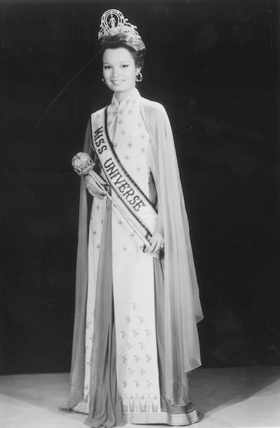 Full-length portrait of Maria Margarita Moran of the Philippines, Miss Universe 1973, wearing a tiara, a sash, a sceptre, and a cape with her gown. CBS Photo Archive/Getty Images