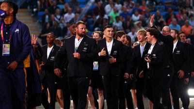 Athletes of Team New Zealand in fine suits. Getty Images