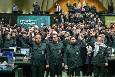 Members of Iran's parliament dressed in IRGC uniform, chant 'Death to America' during a session in Tehran. AFP