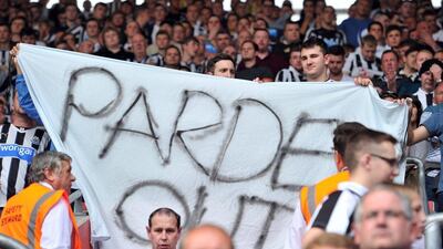 Newcastle United fans hold a banner reading 'Pardew out' in protest against their English manager Alan Pardew during the club's loss to Southampton on Saturday in the Premier League. Glyn Kirk / AFP / September 13, 2014