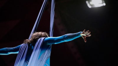 Ukrainian rope artist Jevgenia Shchokina enjoys her moment flying high near the circus tent roof.