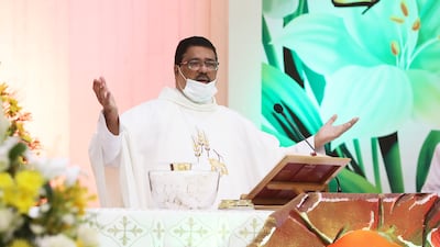 Father Andre during the Easter Sunday Mass held at St Mary's Catholic Church in Dubai. Pawan Singh / The National