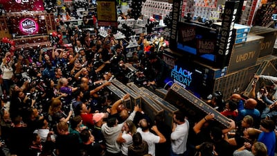Shoppers in Sao Paulo vie for TV sets at a supermarket during a Black Friday sale in Brazil, November 28, 2019. Miguel Schincariol / AFP