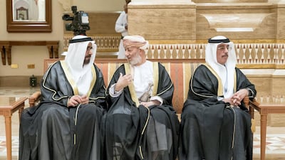 Mohammed Al Suwaidi, UAE Ambassador to Oman, right, and Maj Gen Abdullah Al Ketbi, left, offer their condolences on the death of Sultan Qaboos at Al Alam Palace. Rashed Al Mansoori / Ministry of Presidential Affairs