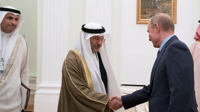 Vladimir Putin, President of Russia (right) greets Dr Anwar Gargash, UAE Minister of State for Foreign Affairs (second left), at the Kremlin. Seen with Khaldoon Khalifa Al Mubarak, CEO and Managing Director Mubadala, Chairman of the Abu Dhabi Executive Affairs Authority and Abu Dhabi Executive Council Member (left). Mohamed Al Hammadi / Crown Prince Court - Abu Dhabi