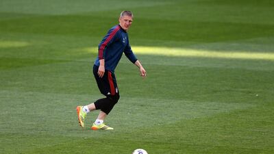 Bastian Schweinsteiger runs with the ball during their FC Bayern Muenchen training at the Santiago Bernabeu Stadium ahead of the UEFA Champions League semi-final first leg match against Real Madridon April 22, 2014 in Madrid, Spain. Martin Rose/Bongarts/Getty Images