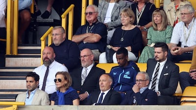 Newcastle's club-record signing Alexander Isak - second row, second from right - watching from the stands at Molineux. Reuters