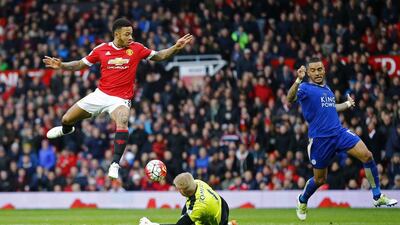Leicester City's Kasper Schmeichel in action with Manchester United's Memphis Depay. Reuters / Darren Staples