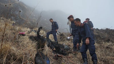 Nepalese police find a body near the wreckage of a Tara Air Twin Otter plane after it crashed due to bad weather in Myagdi, Nepal. Santosh Gautam / Reuters