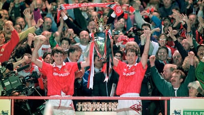 Manchester United captain Steve Bruce and Bryan Robson hold aloft the FA Premier League trophy after the final home game of the 1992-93 season, when they finished as champions with 84 points. Getty