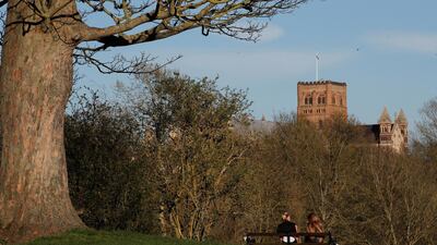 Two women sitting on a bench in the UK. Reuters
