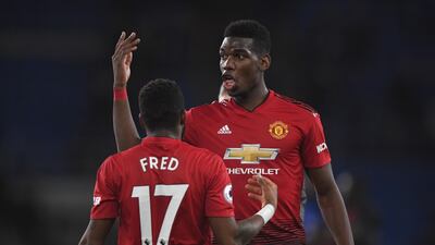 Manchester United players Fred and Paul Pogba celebrate. Getty Images