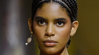 At the Dior haute couture show, skin was left almost bare, while eyes were given a subtle sweep of shadow, and blusher was kept to a minimum. Getty