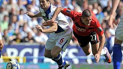 Manchester United's Federico Macheda, right, goes to ground after a challenge from Ryan Nelsen, the Blackburn Rovers defender, during their goalless draw at Ewood Park yesterday.