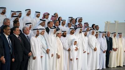Sheikh Mohammed bin Zayed, Crown Prince of Abu Dhabi and Deputy Supreme Commander of the UAE Armed Forces (front row, ninth left), stands for a photograph with members of "Brainstorm Alliance" initiative, coordinated by The Emirates Center for Strategic Studies and Research (ECSSR), during a Sea Palace barza. Courtesy Crown Prince Court - Abu Dhabi