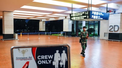 An Indonesian soldier walks at Soekarno-Hatta International Airport after Sriwijaya Air plane flight SJ182 with more than 50 people on board lost contact after taking off, according to local media, in Tangerang, near Jakarta, Indonesia. Reuters