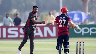 Junaid Siddique of UAE celebrates the wicket of Ben Ward.