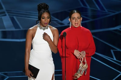Comedian Tiffany Haddish (L) and US actress Maya Rudolph present the Oscar for Best Documentary Short Subject during the 90th Annual Academy Awards show on March 4, 2018 in Hollywood, California. / AFP PHOTO / Mark Ralston