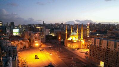 An aerial view shows Beirut's Martyrs Square deserted during a nighttime curfew. Lebanon, which is going through an economic crisis, recorded a sharpest deterioration in business conditions. AFP